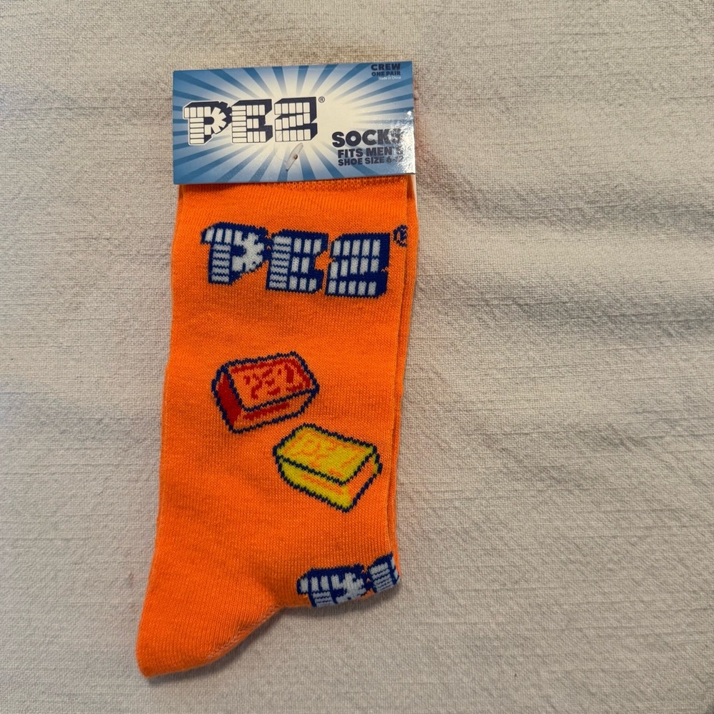 NWT PEZ Candy Bright Orange 2024 Novelty Crew Socks, Fits Men's Shoe Sizes 6-12